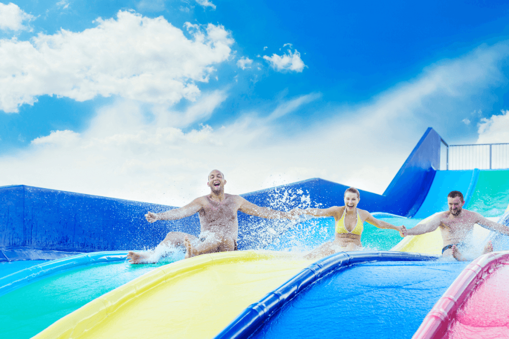 people going down water slides together